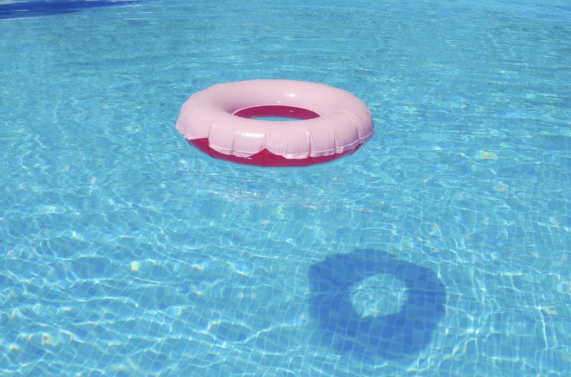 Relaxing pool float in crystal clear maintained pool water
